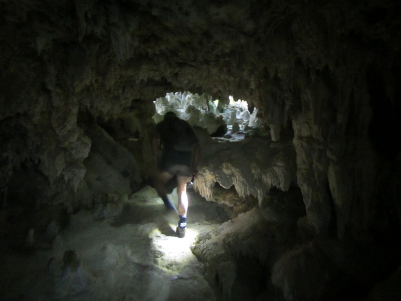 Journeying through the tunnels and caverns of Ana takitaki Cave, Atiu (the Cook Islands).